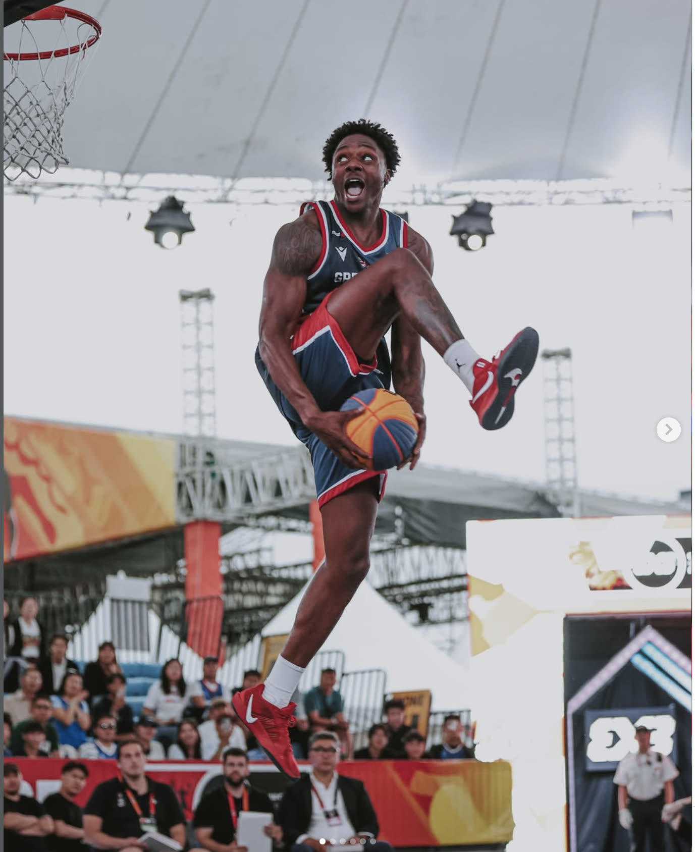 The Royal Guard in Great Britain kit rising for a between-the-legs dunk