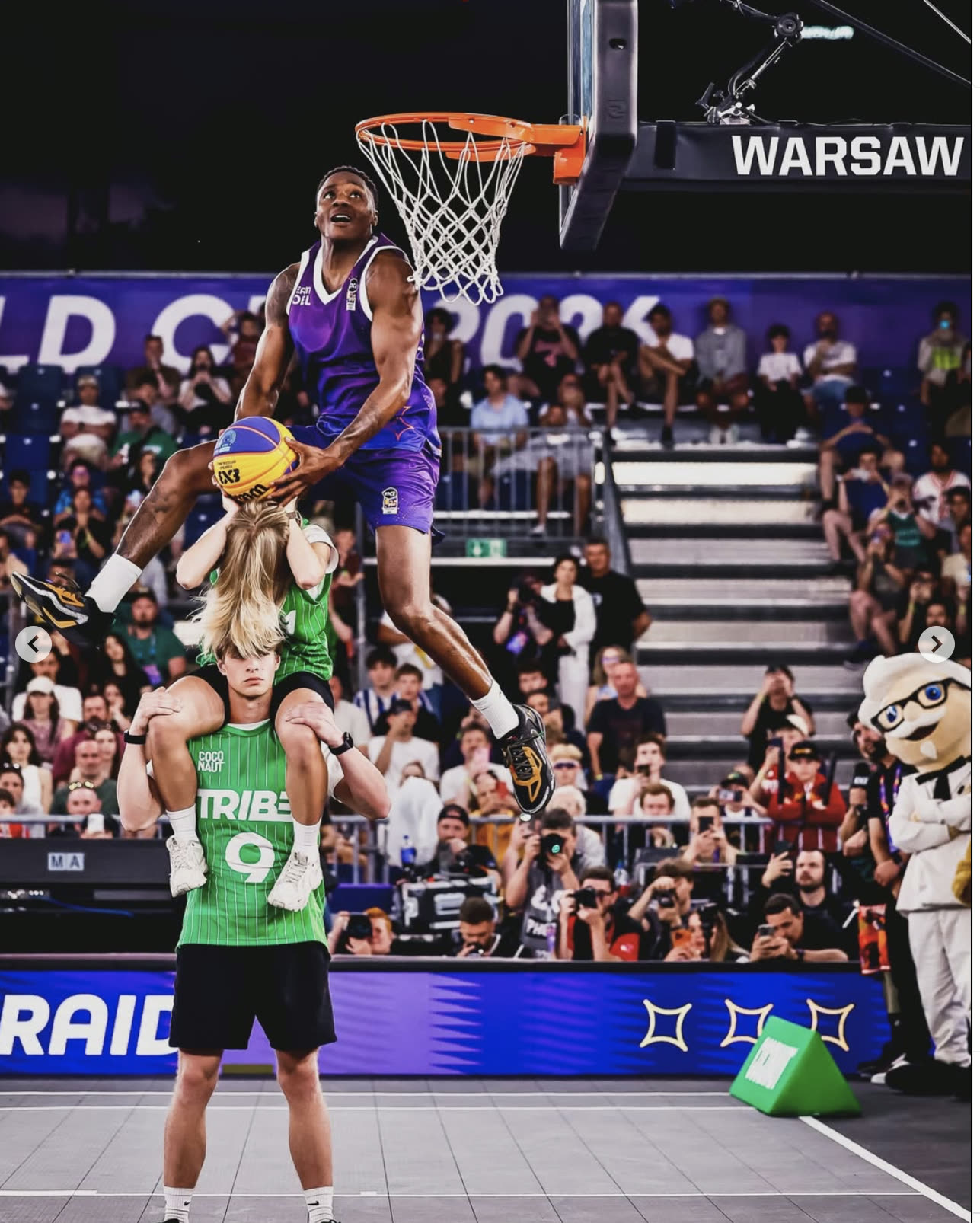 The Royal Guard dunking over two people at the FIBA 3x3 World Cup in Warsaw