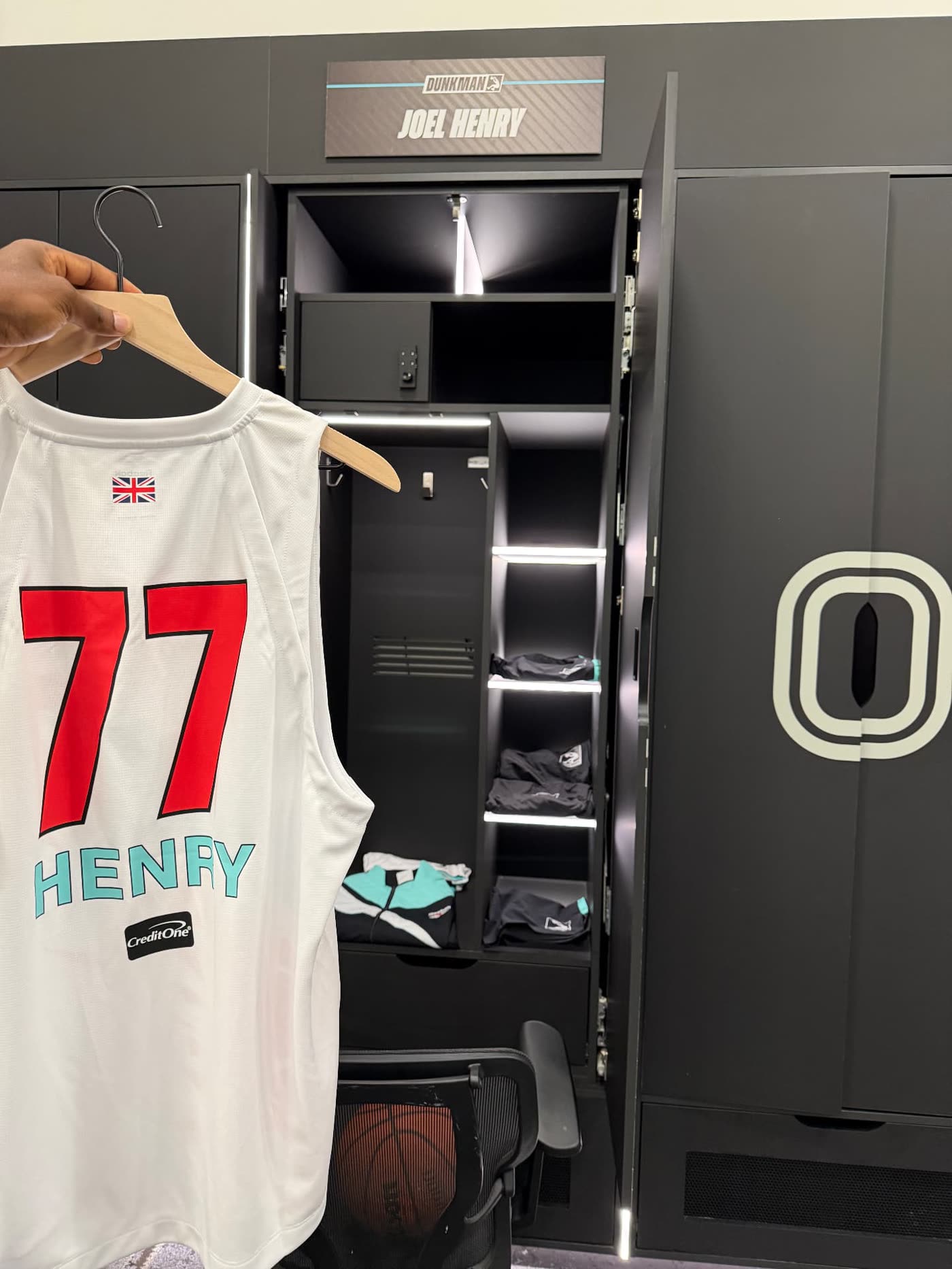 Henry 77 Dunkman League jersey held up in the locker room