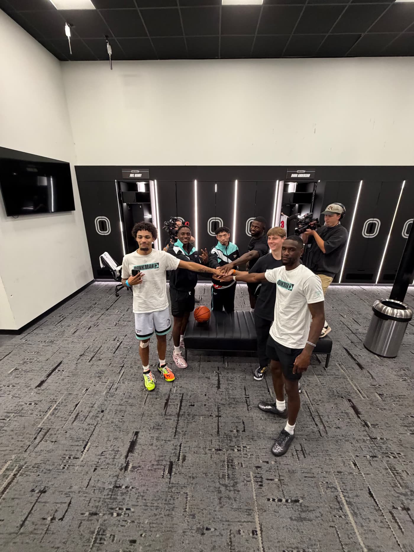 Dunkman League athletes huddled in the locker room before a show