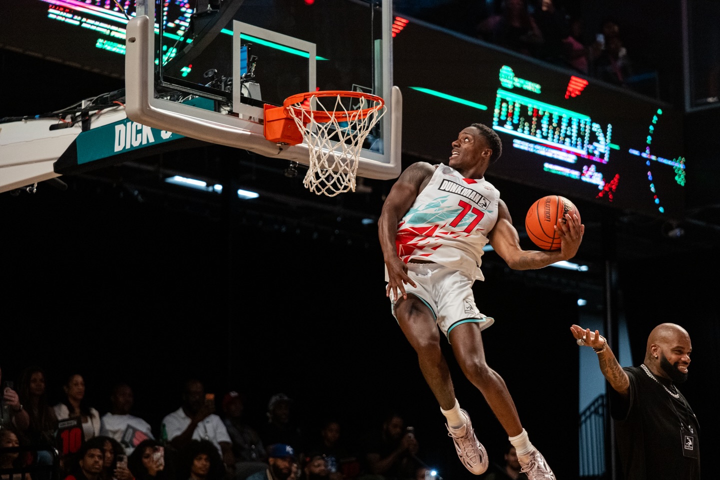 The Royal Guard soaring for a one-handed dunk under arena lights